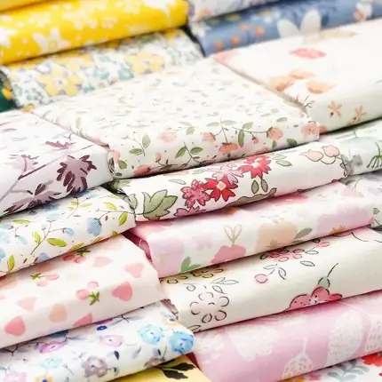 Sustainable organic cotton quilting fabric featuring delicate small floral prints for eco-friendly sewing.