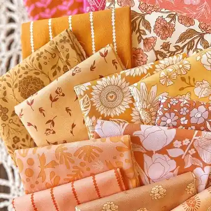 Premium collection of retro-style floral printed quilting fabric in curated warm color palettes for boho patchwork.